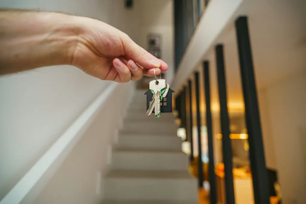 Hand holding the keys to a new home